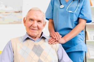 caregiver-holding-old-man-s-shoulder
